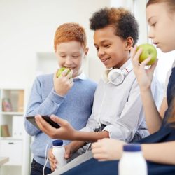school children using phone at school.jpg school children using phone at school.jpg